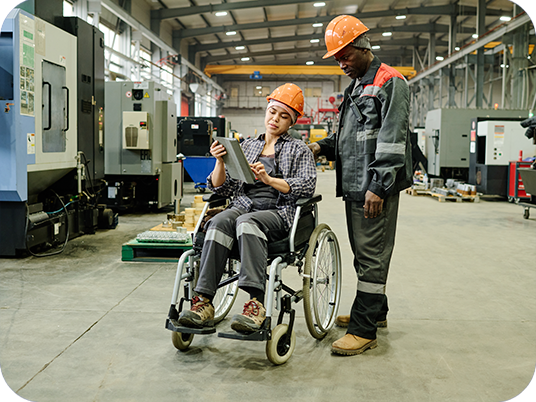 Women in wheelchair working in a industrial warehouse